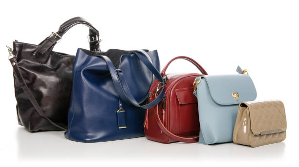 istock Woman's female bags pile many different 1072203972