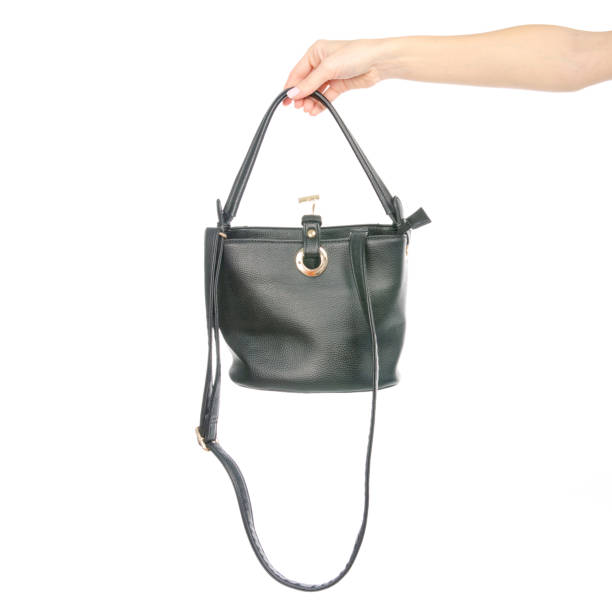 istock Woman's female black brown leather bag in hand 1072203986