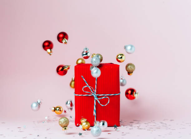 istock Christmas gift box on festive pink background. 1072204340