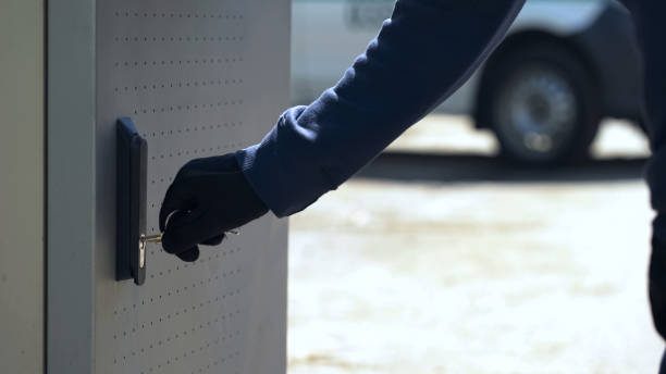 istock CIT guard opening ATM safe with key to load storage with cash, technical service 1072204970