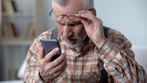 istock Bewildered old man looking at cellphone, new technology complicated for elderly 1072205044