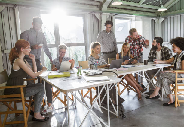 istock Group of multi-tasking entrepreneurs working in a modern office. 1072205440