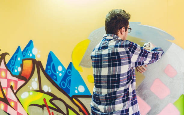 istock Man drawing street art graffiti 1072208120