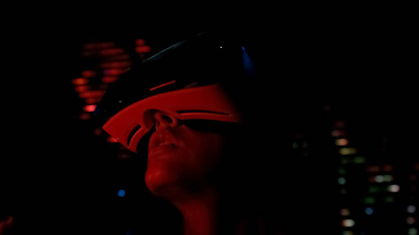 istock Frightened girl in vr headset plays horror game, virtual reality glasses, future 1072208222