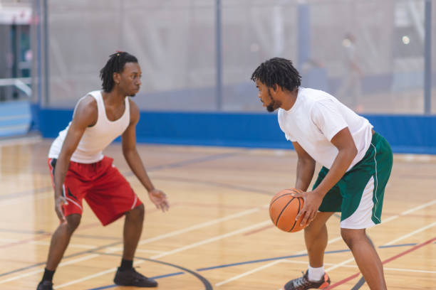 istock Two friends playing basketball 1072213352