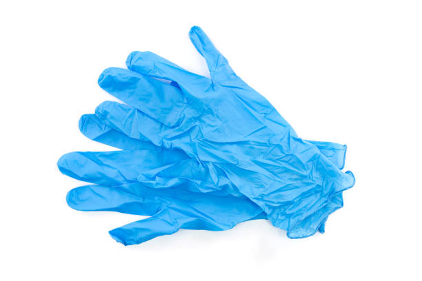 Blue lab gloves Blue latex medical and laboratory gloves isolated on white background surgical glove stock pictures, royalty-free photos & images