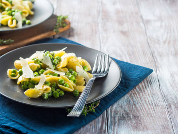 istock Italian orecchiette pasta with peas and cheese 1072222912