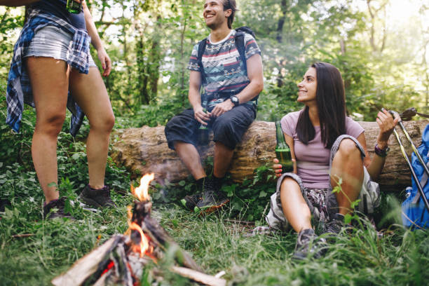 istock Young hikers relaxing and drinking beer 1072227198