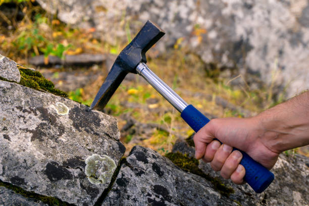 istock geological hammer in hand 1072227754