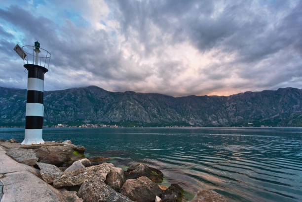 istock Sunset on the sea with mountains 1072230614