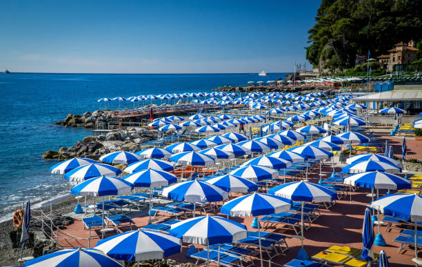 Umbrellas at the beach Beach umbrellas at Santa Margherita Ligure santa margherita ligure italy stock pictures, royalty-free photos & images