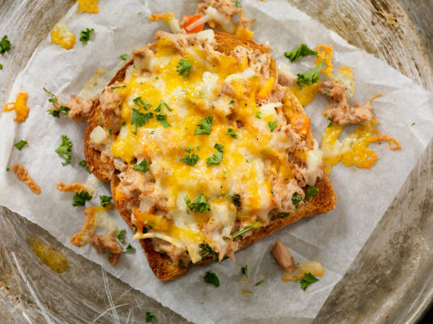 Tuna Melt on Toast Tuna Melt on Toast with Onions, Peppers and Parsley melting tuna cheese toast stock pictures, royalty-free photos & images