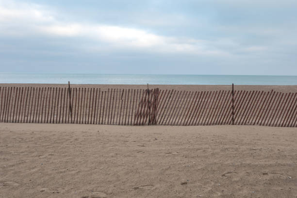 istock Wooden fencing crossing frame on beach 1072235038