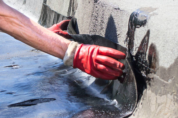 istock Roll roofing Installation with propane blowtorch during construction works 1072240916
