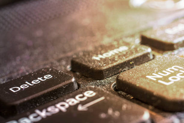 istock dirty laptop keyboard macro, front and back background blurred 1072244684