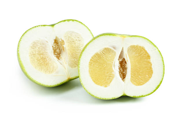 istock pomelo sweetie cut on white isolated background 1072247658