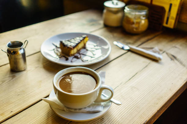 Coffee Americano with hot milk, chocolate cheesecake