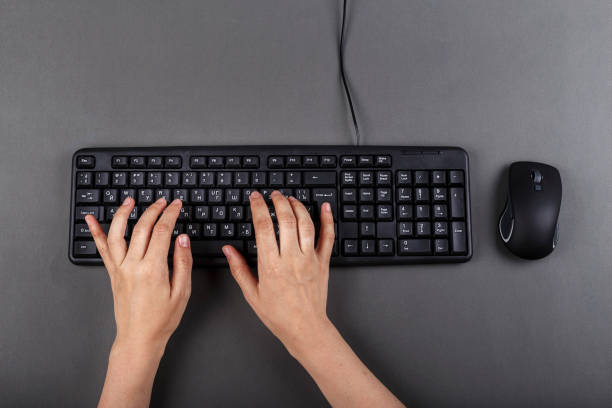 istock female hands on a black computer keyboard. business planning. 1072250022