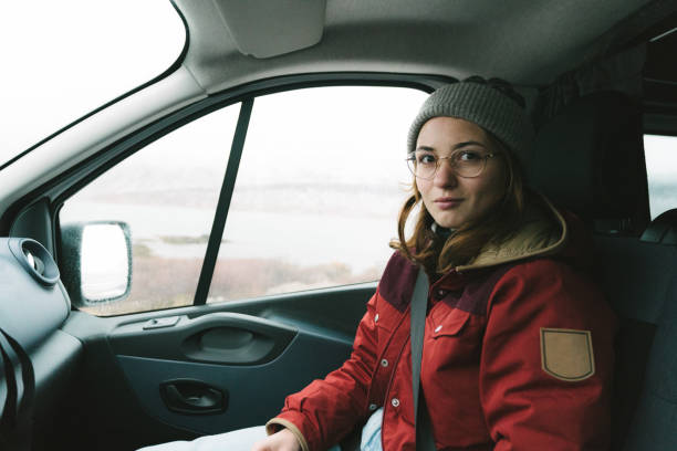 istock Woman sitting on passenger seat in  camper van 1072252242