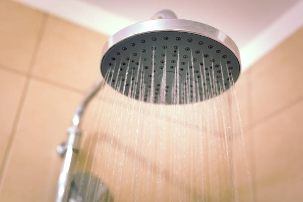 istock Water running from the shower head in the bathroom, close-up 1072254996