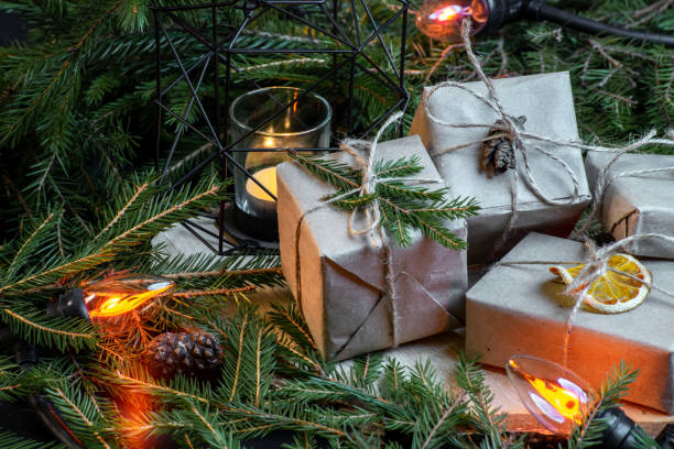 istock Christmas gift boxes with christmas tree branches and decoration and garland. 1072261442