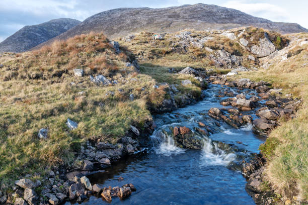 istock Mountain stream, Maumturk Mountains, Connemara, Ireland 1072261714