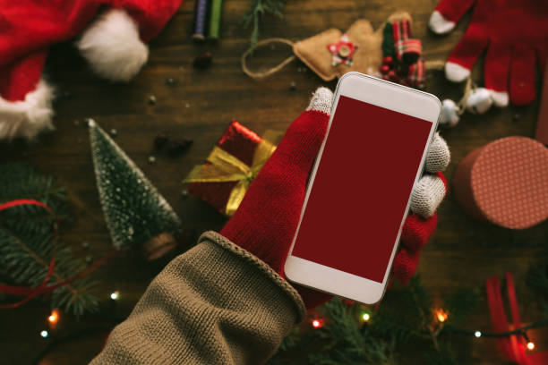 Smartphone in hand for Christmas season mock up