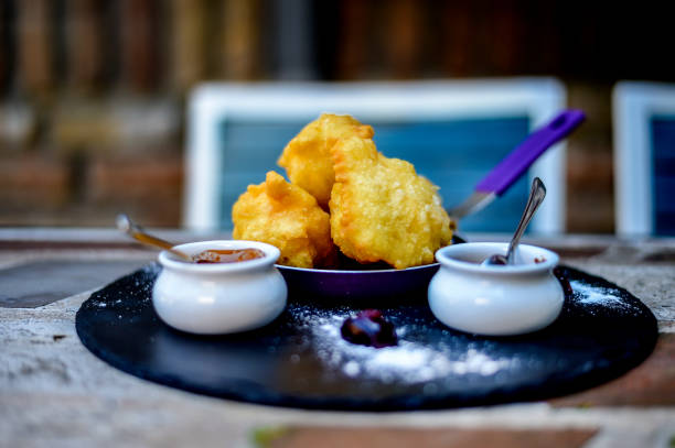 Sweet homemade beignets covered with powdered sugar. stock photo