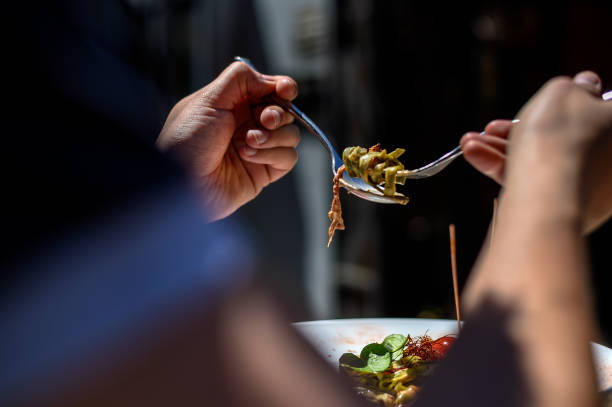 Man Eating Italian Pasta