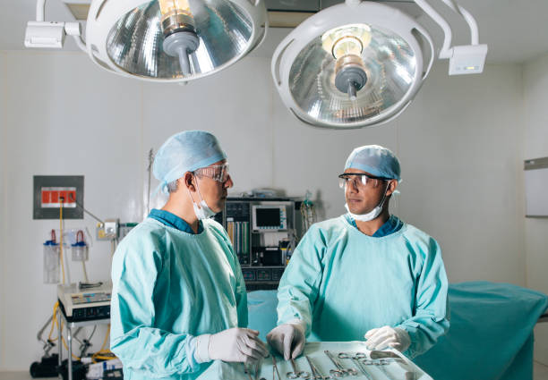 istock Healthcare workers standing and preparing for surgery 1072275626