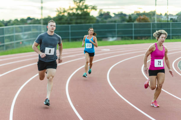 istock Athletes racing on running track 1072279868