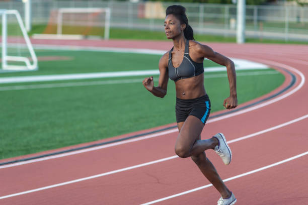 istock Black woman running track 1072279898