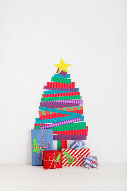istock Christmas tree wall decoration and a gifts. 1072286926