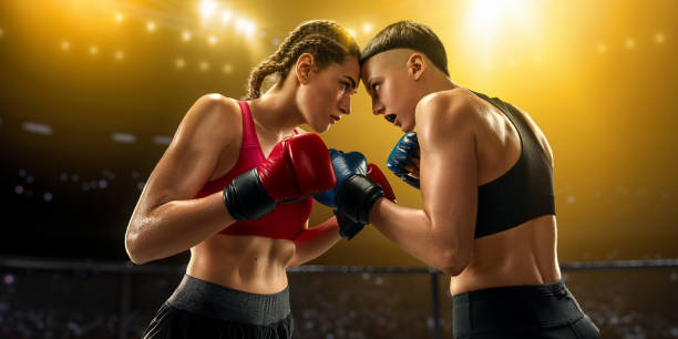 istock Female MMA fighters in professional boxing ring 1072287076