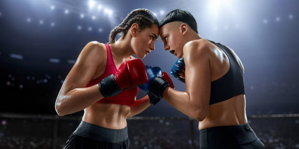 istock Female MMA fighters in professional boxing ring 1072287080