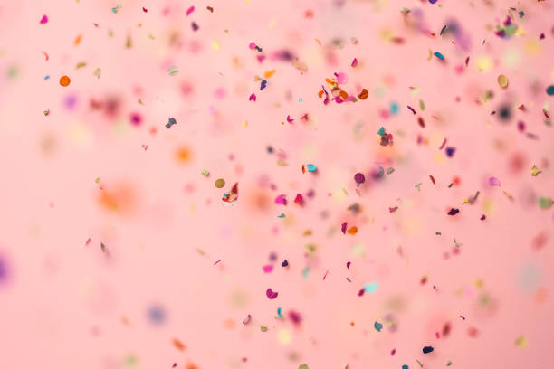 istock Confetti rain on pink background 1072291598
