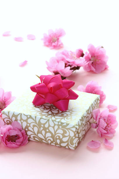 istock peach flowers and gift 1072295618