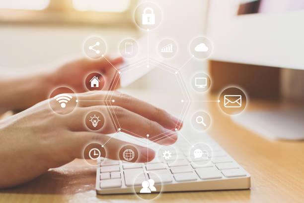 istock Hand holding credit card and using computer desktop with icon technology internet of things (IOT). Innovative convenience smart life concept 1072296380