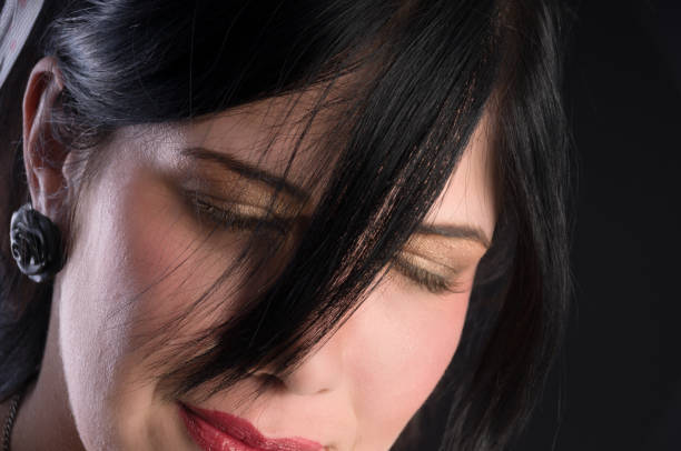 Portrait of a beautiful woman on black background