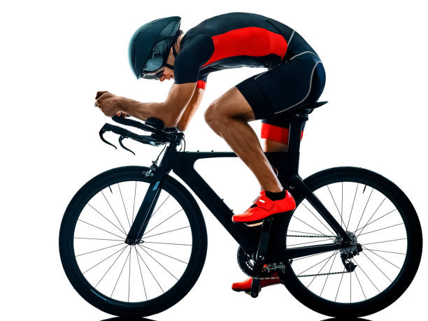 istock triathlete triathlon Cyclist cycling silhouette isolated white b 1072299858