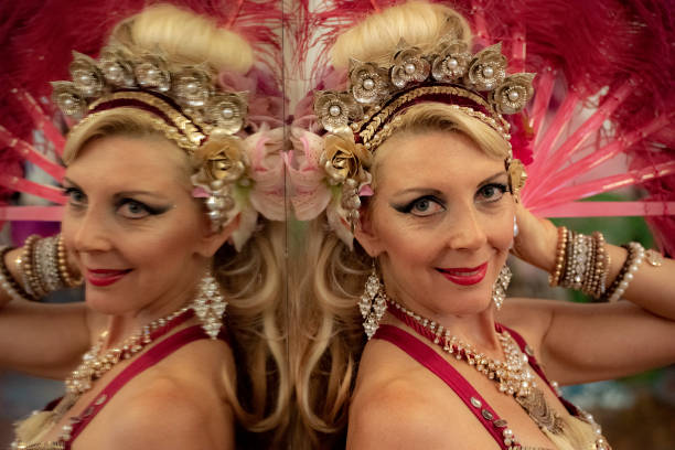 istock Macedonian belly dancer rehearses with her own image in a dancers mirror. 1072303140