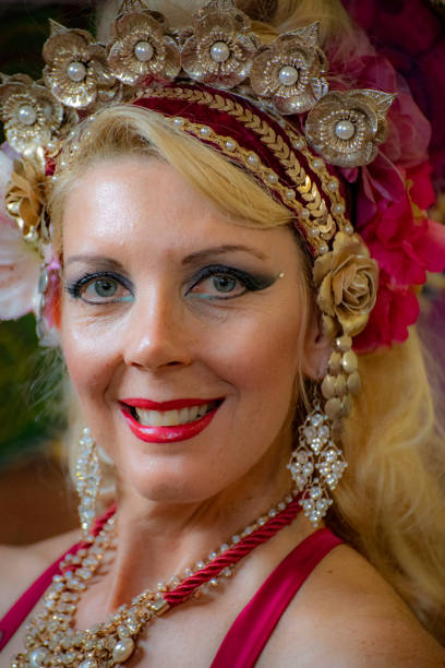 Close up of mature Macedonian belly dancer rehearses her routine in a studio.
