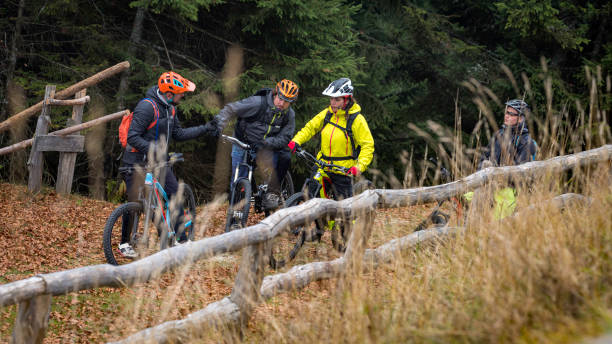 istock Group of mountain bikers taking a break on top of a hill 1072309680