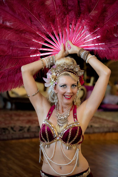 istock Middle aged Macedonian belly dancer rehearses her routine in a studio. 1072309816
