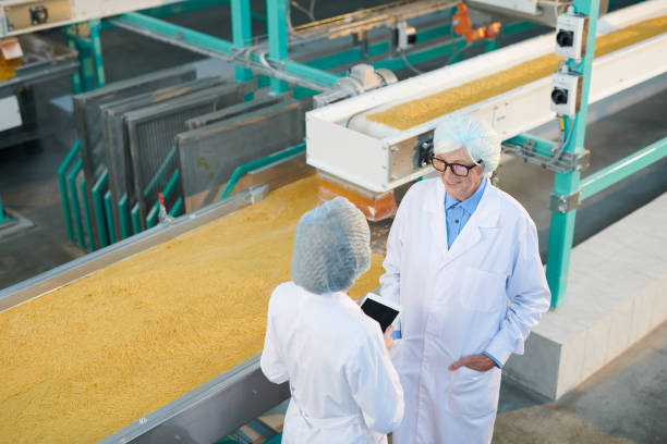 istock Two Factory Workers at Production Line 1072311042