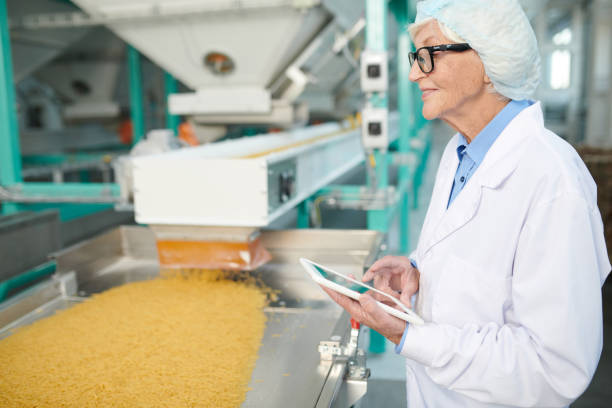istock Senior Woman Enjoying Work at Factory 1072311086