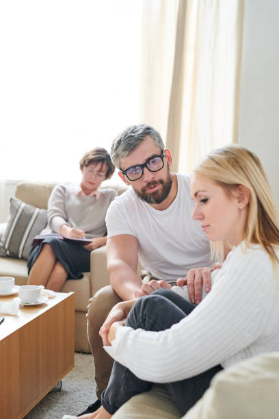 istock Young wife feeling sorrow at therapy session 1072311914