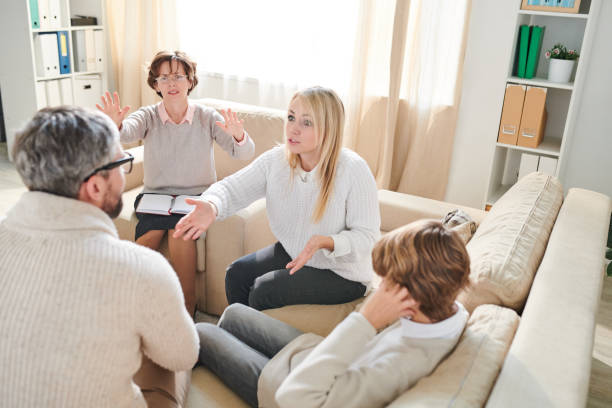 istock Aggressive parents fighting at therapy session 1072311970