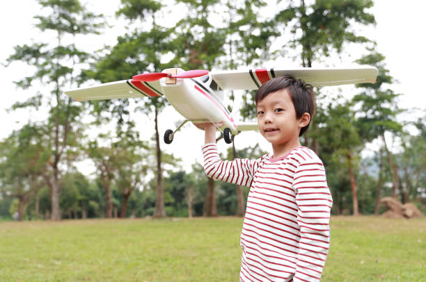 Boy hand holding a toy plane