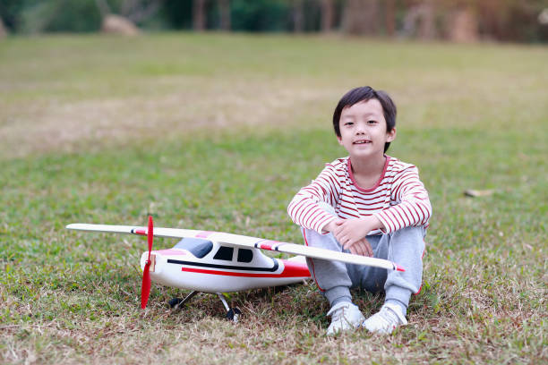 Boy hand holding a toy plane